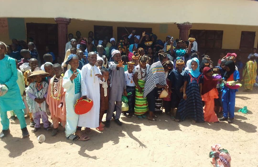 Group of Taibah Schools students standing together during a school community activity, celebrating culture and unity.
