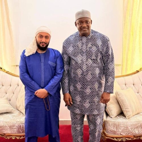The President of The Gambia, His Excellency Adama Barrow, standing with a cofounder of Taibah Schools during an official meeting.